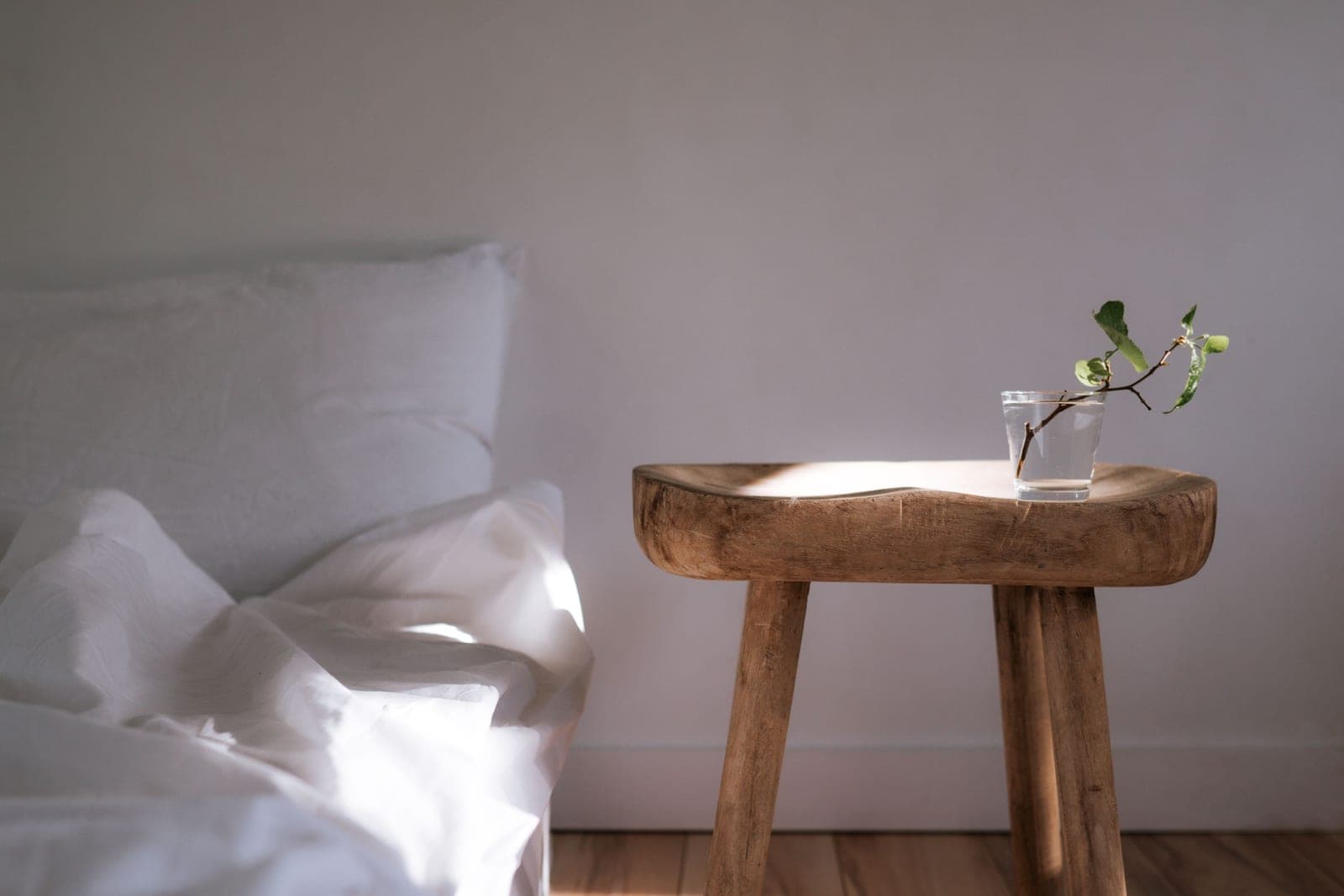 A calm, uncluttered room with natural light — the kind of space an in-home massage is set up in.